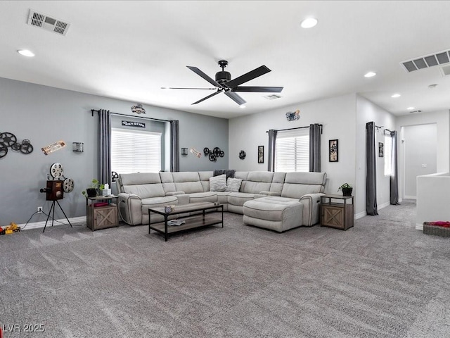 living area with carpet, ceiling fan, baseboards, and recessed lighting