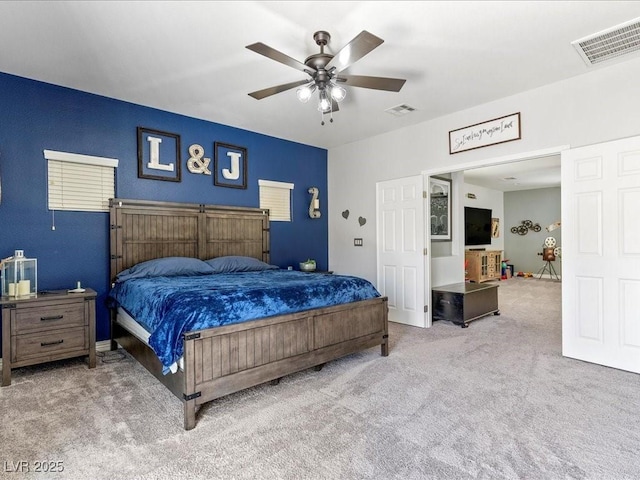 carpeted bedroom featuring a ceiling fan