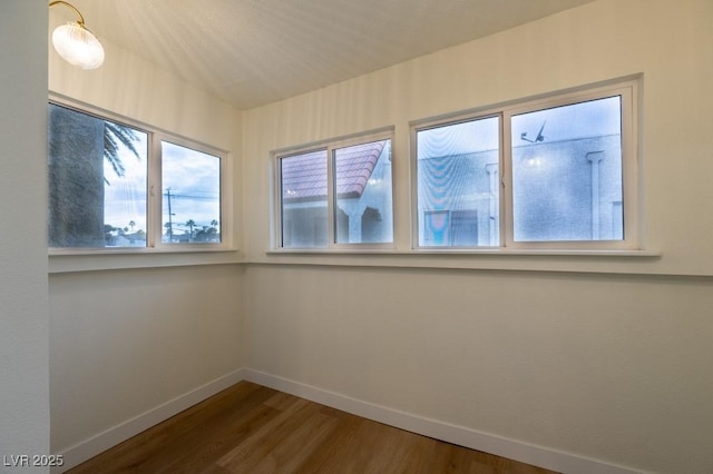 5040 Spencer St Unit D, Las Vegas, NV 89119 - unfurnished room with baseboards and wood finished floors