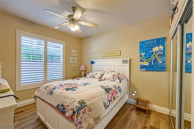 2050 W Warm Springs Rd Unit 3211, Henderson, NV 89014 - bedroom with baseboards, wood finished floors, and ceiling fan