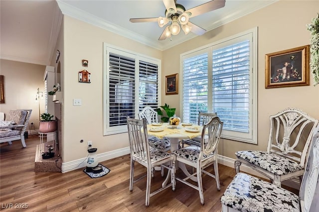 2050 W Warm Springs Rd Unit 3211, Henderson, NV 89014 - dining area featuring crown molding, baseboards, wood finished floors, and a ceiling fan