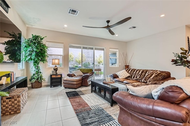 living area with ceiling fan, light tile patterned floors, recessed lighting, and baseboards