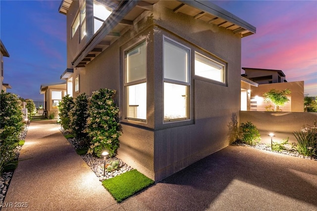 436 Crown Mesa Ave, Las Vegas, NV 89138 - view of property exterior with stucco siding, fence, and a patio