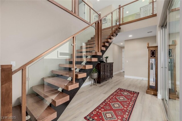 436 Crown Mesa Ave, Las Vegas, NV 89138 - stairs featuring a towering ceiling, wood finished floors, baseboards, and recessed lighting