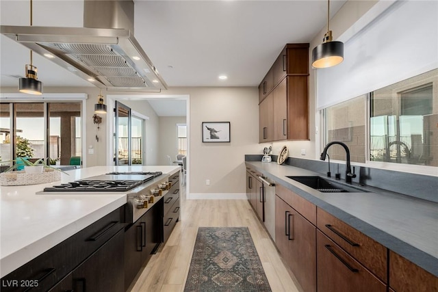 436 Crown Mesa Ave, Las Vegas, NV 89138 - kitchen with a sink, stainless steel gas cooktop, exhaust hood, light wood-type flooring, and recessed lighting