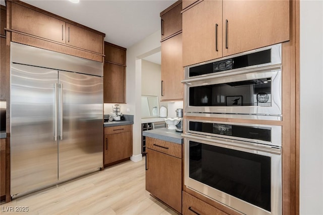 436 Crown Mesa Ave, Las Vegas, NV 89138 - kitchen with appliances with stainless steel finishes and light wood-type flooring