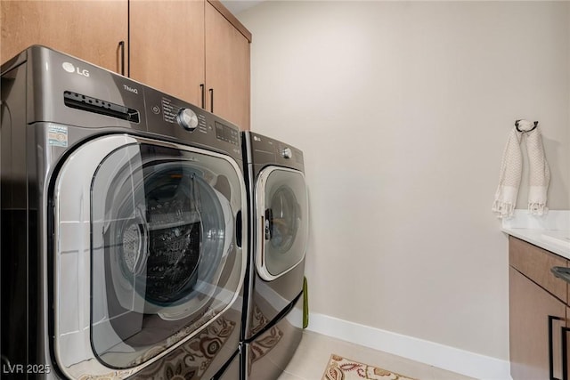 436 Crown Mesa Ave, Las Vegas, NV 89138 - laundry area with washer and clothes dryer, cabinet space, and baseboards
