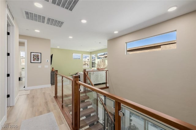 436 Crown Mesa Ave, Las Vegas, NV 89138 - hallway featuring an upstairs landing, healthy amount of natural light, recessed lighting, light wood finished floors, and baseboards