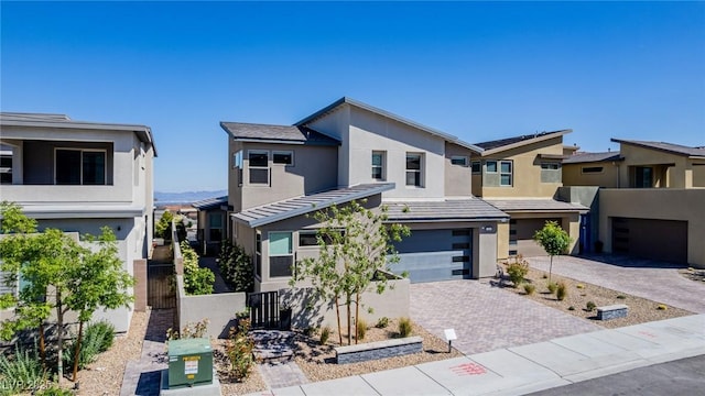 436 Crown Mesa Ave, Las Vegas, NV 89138 - view of front facade featuring an attached garage, stucco siding, driveway, fence, and a residential view