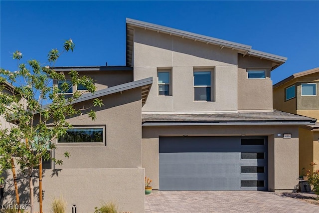 436 Crown Mesa Ave, Las Vegas, NV 89138 - view of front of home with a garage, stucco siding, and driveway