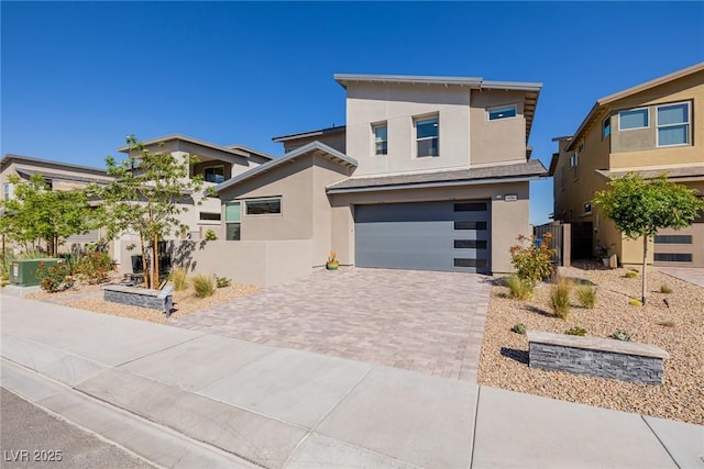 436 Crown Mesa Ave, Las Vegas, NV 89138 - contemporary home featuring stucco siding, driveway, an attached garage, and fence