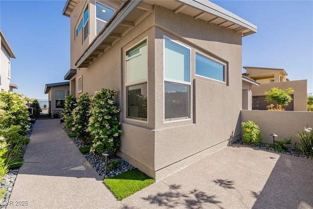 436 Crown Mesa Ave, Las Vegas, NV 89138 - view of side of property with stucco siding, fence, and a patio area