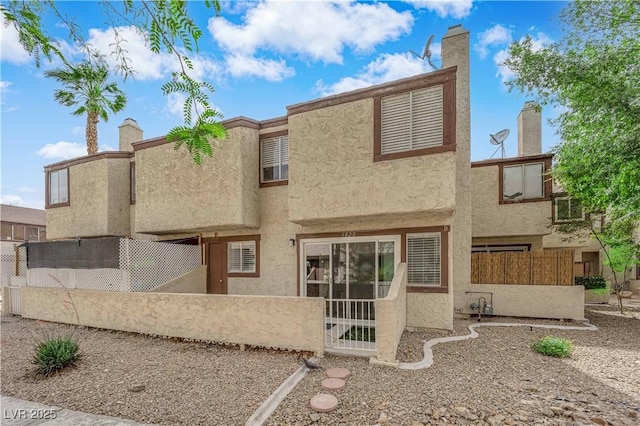 5029 Spencer St Unit D, Las Vegas, NV 89119 - back of house with fence and stucco siding