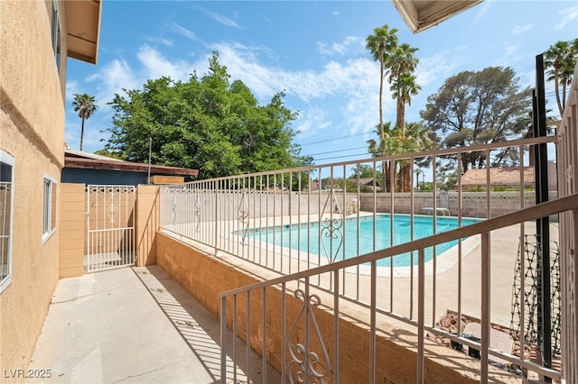 view of pool featuring a fenced backyard and a patio