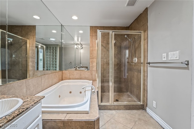 full bathroom featuring a shower stall, tile patterned floors, vanity, a tub with jets, and recessed lighting