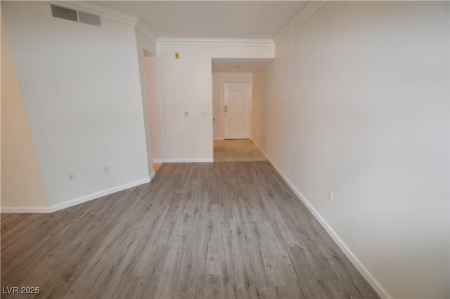 270 E Flamingo Rd Unit 136, Las Vegas, NV 89169 - unfurnished room with ornamental molding, wood finished floors, and baseboards