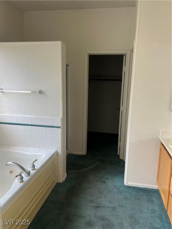 128 Appian Way, Henderson, NV 89002 - full bathroom with a garden tub, vanity, a walk in closet, and carpet