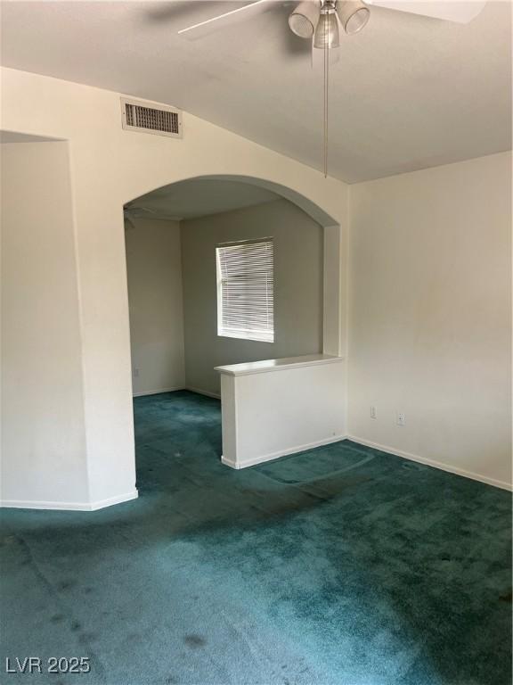 128 Appian Way, Henderson, NV 89002 - spare room with arched walkways, carpet floors, a ceiling fan, baseboards, and lofted ceiling