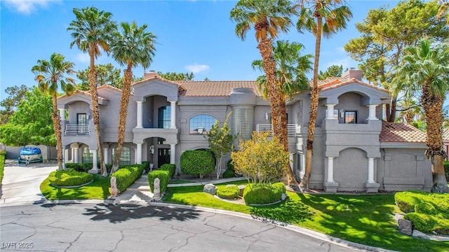 1931 Pago Ct, Las Vegas, NV 89117 - mediterranean / spanish-style home with stucco siding, a tiled roof, and a chimney