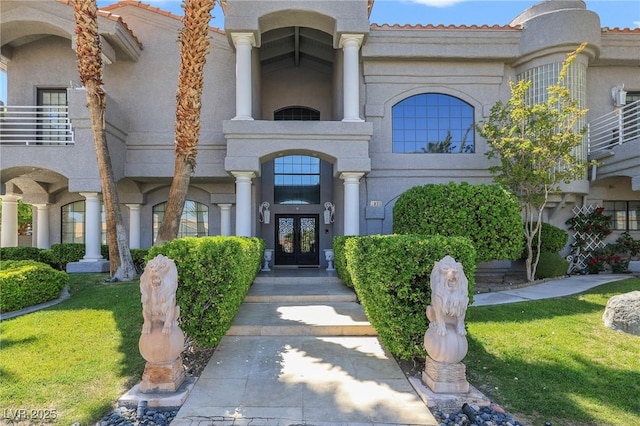 1931 Pago Ct, Las Vegas, NV 89117 - doorway to property with french doors, stucco siding, and a lawn