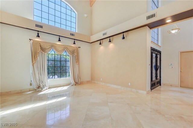 1931 Pago Ct, Las Vegas, NV 89117 - empty room with a towering ceiling and baseboards