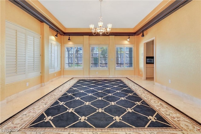 1931 Pago Ct, Las Vegas, NV 89117 - unfurnished dining area featuring a chandelier, baseboards, and tile patterned floors