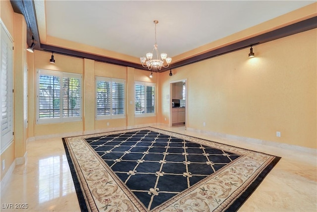 1931 Pago Ct, Las Vegas, NV 89117 - unfurnished dining area featuring a chandelier, tile patterned flooring, and track lighting