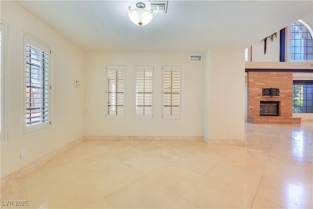 1931 Pago Ct, Las Vegas, NV 89117 - tiled spare room with a glass covered fireplace and baseboards