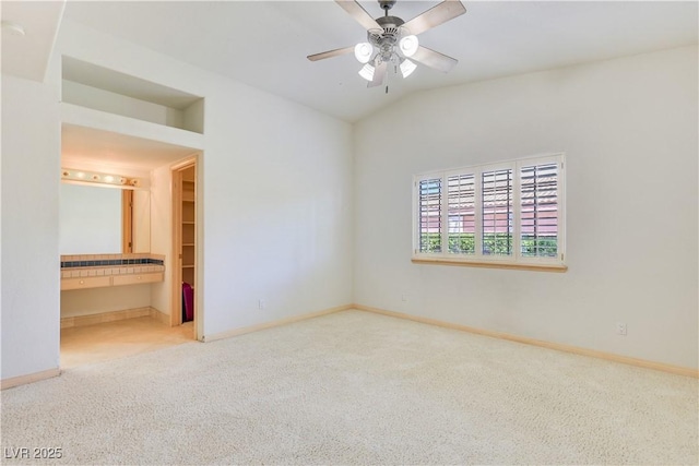 1931 Pago Ct, Las Vegas, NV 89117 - unfurnished bedroom featuring carpet, vaulted ceiling, and ensuite bath