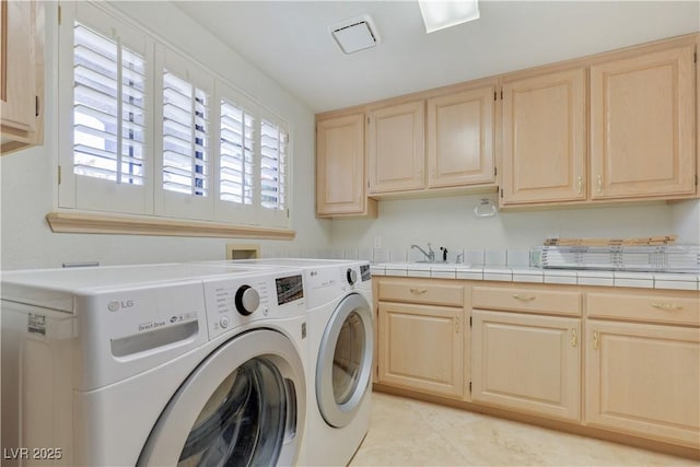 1931 Pago Ct, Las Vegas, NV 89117 - laundry room with cabinet space, washer and clothes dryer, and light tile patterned floors
