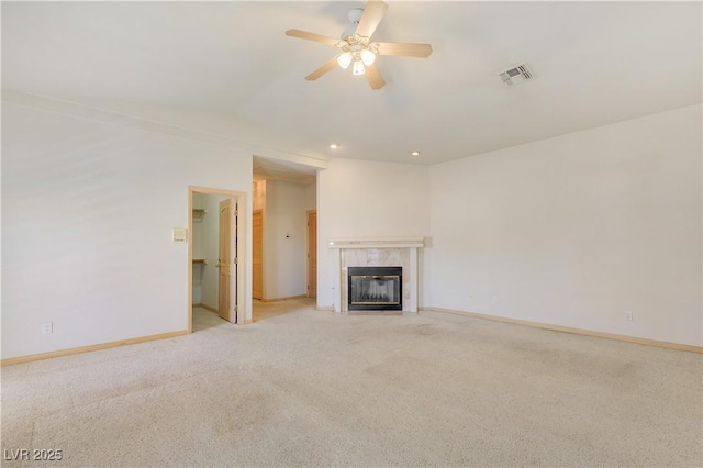 1931 Pago Ct, Las Vegas, NV 89117 - unfurnished living room featuring light carpet, a tiled fireplace, a ceiling fan, lofted ceiling, and recessed lighting