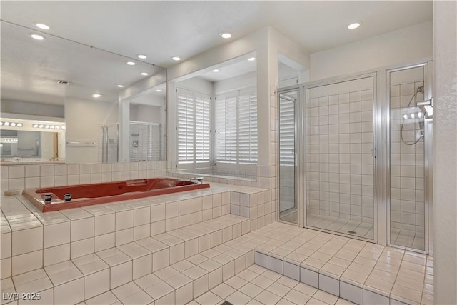1931 Pago Ct, Las Vegas, NV 89117 - bathroom with tile patterned floors, a bath, a shower stall, and recessed lighting