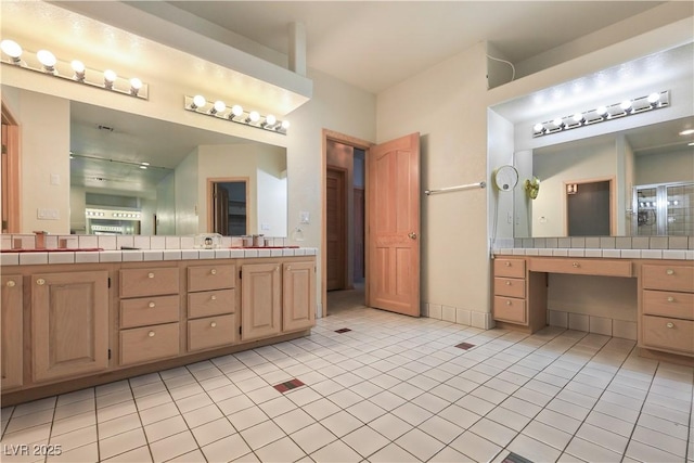 1931 Pago Ct, Las Vegas, NV 89117 - full bath featuring tile patterned flooring, double vanity, and a shower with door