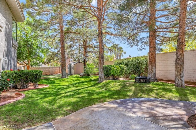 1931 Pago Ct, Las Vegas, NV 89117 - fenced backyard featuring a patio and a storage shed