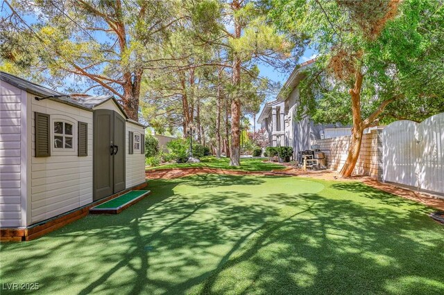 1931 Pago Ct, Las Vegas, NV 89117 - view of yard with a storage unit and an area to practice putting