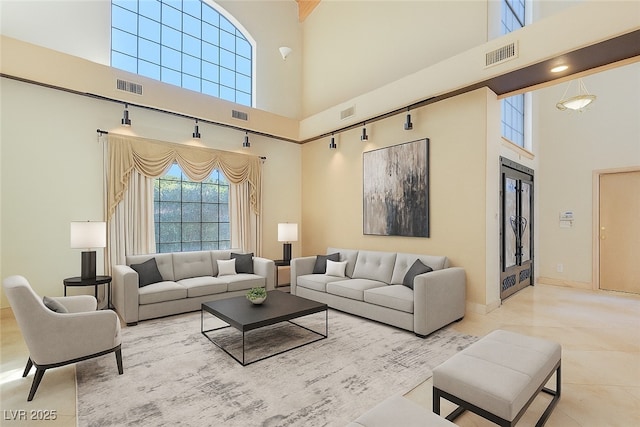 1931 Pago Ct, Las Vegas, NV 89117 - living room featuring a high ceiling and tile patterned floors
