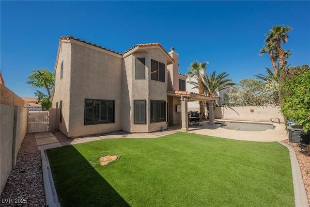 back of property featuring stucco siding, a patio area, a tiled roof, and a pergola