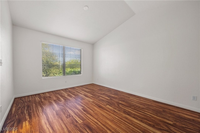 5148 Forest Oaks Dr, Las Vegas, NV 89149 - spare room with wood finished floors, vaulted ceiling, and baseboards