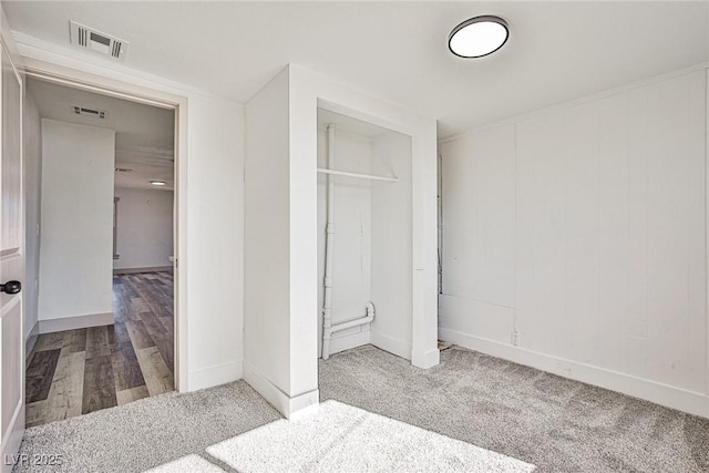 603 W Adams Ave, Las Vegas, NV 89106 - unfurnished bedroom featuring a closet, baseboards, and carpet floors