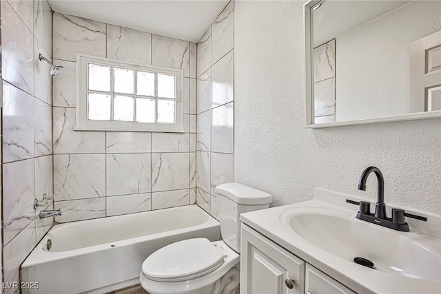 603 W Adams Ave, Las Vegas, NV 89106 - bathroom with a textured wall, toilet, bathtub / shower combination, and vanity