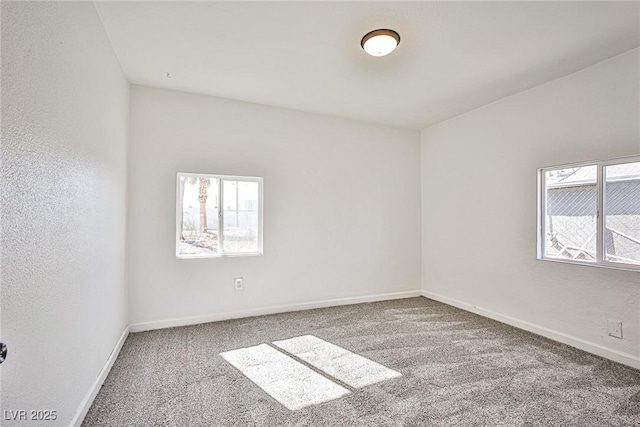 603 W Adams Ave, Las Vegas, NV 89106 - spare room featuring carpet, plenty of natural light, and baseboards
