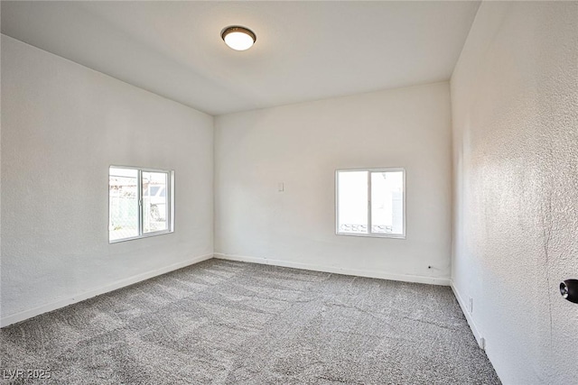 603 W Adams Ave, Las Vegas, NV 89106 - empty room with healthy amount of natural light, carpet floors, and baseboards