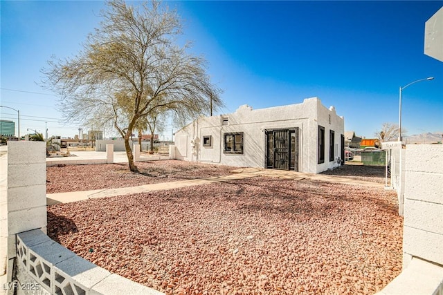 603 W Adams Ave, Las Vegas, NV 89106 - view of front of home featuring fence and stucco siding