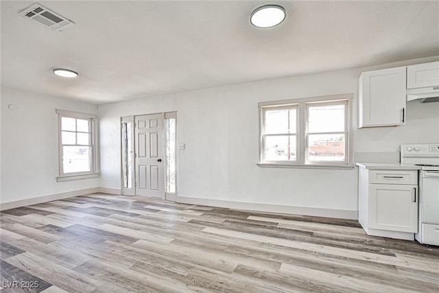 603 W Adams Ave, Las Vegas, NV 89106 - unfurnished living room featuring light wood finished floors and baseboards