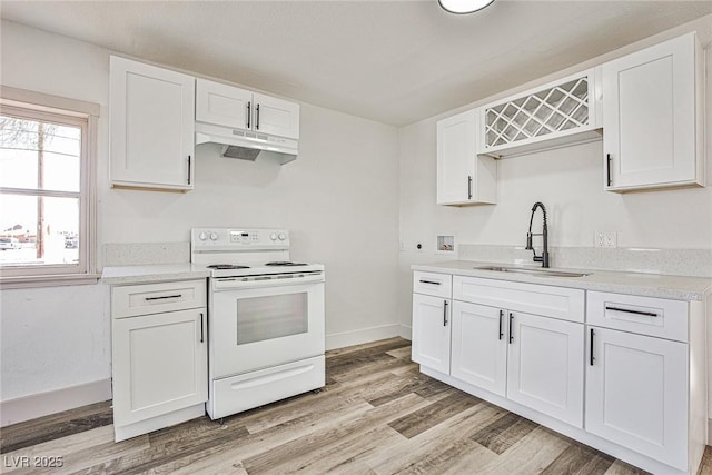 603 W Adams Ave, Las Vegas, NV 89106 - kitchen featuring white electric range, a sink, under cabinet range hood, white cabinets, and light wood-type flooring