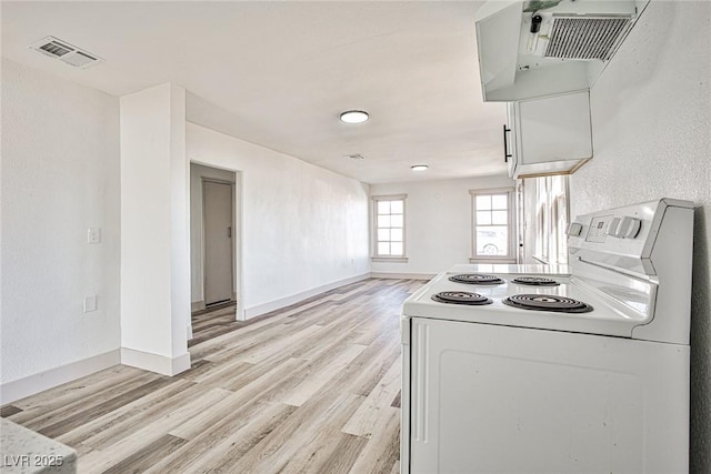 603 W Adams Ave, Las Vegas, NV 89106 - kitchen featuring white range with electric stovetop, light wood-style flooring, baseboards, and ventilation hood