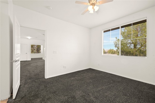 913 Duckhorn Ct Unit 204, Las Vegas, NV 89144 - spare room featuring dark carpet, a ceiling fan, and baseboards