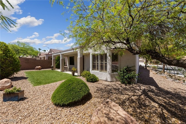 2029 Poppywood Ave, Henderson, NV 89012 - rear view of house with stucco siding, a fenced backyard, and a patio area