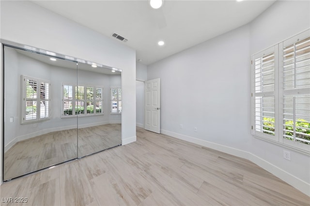 2029 Poppywood Ave, Henderson, NV 89012 - unfurnished bedroom with a closet, wood finished floors, recessed lighting, and baseboards