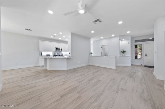 2029 Poppywood Ave, Henderson, NV 89012 - unfurnished living room featuring a ceiling fan, light wood-style floors, recessed lighting, and baseboards